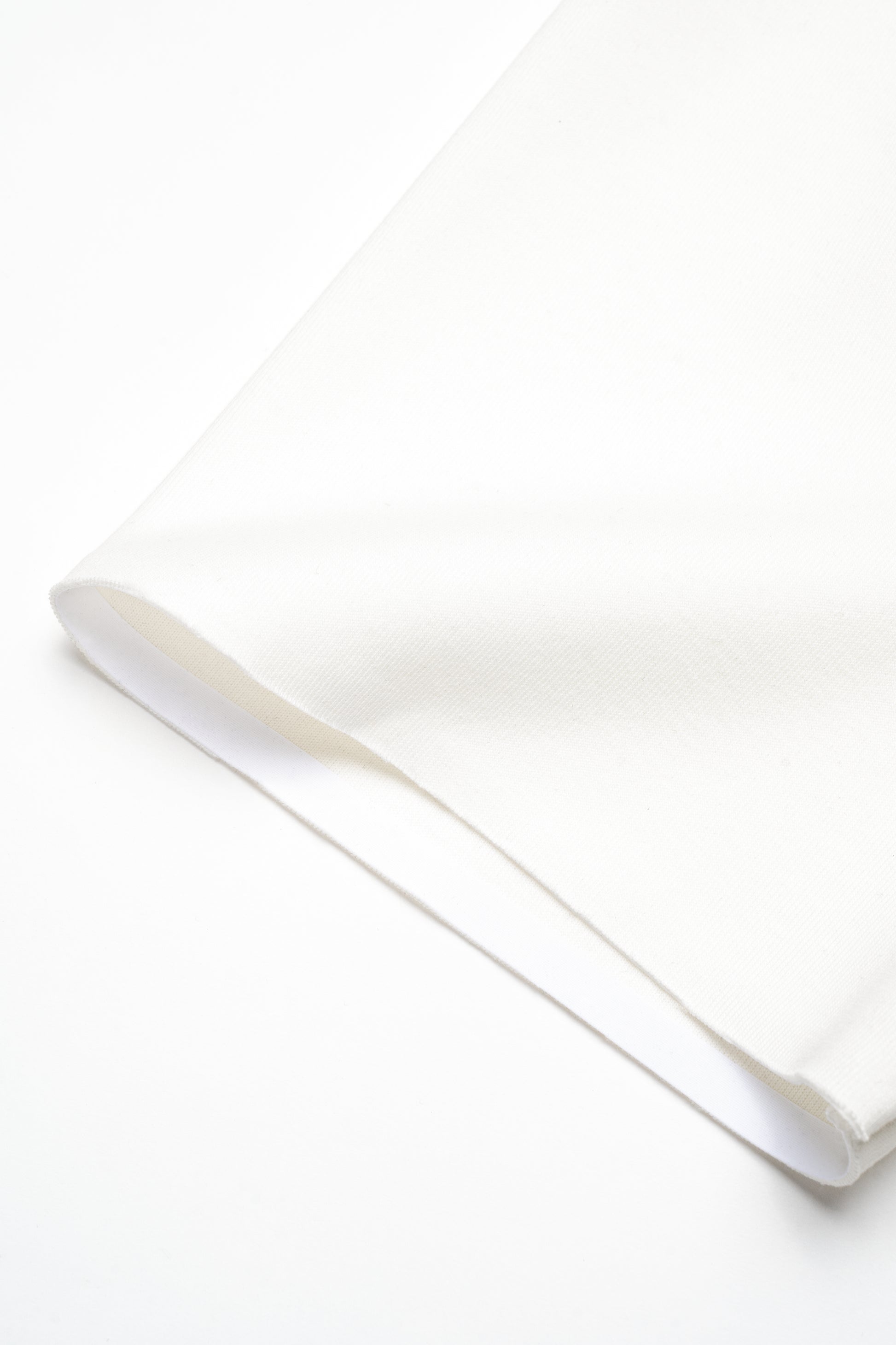 Close up of white boxy t-shirt sleeve detail 