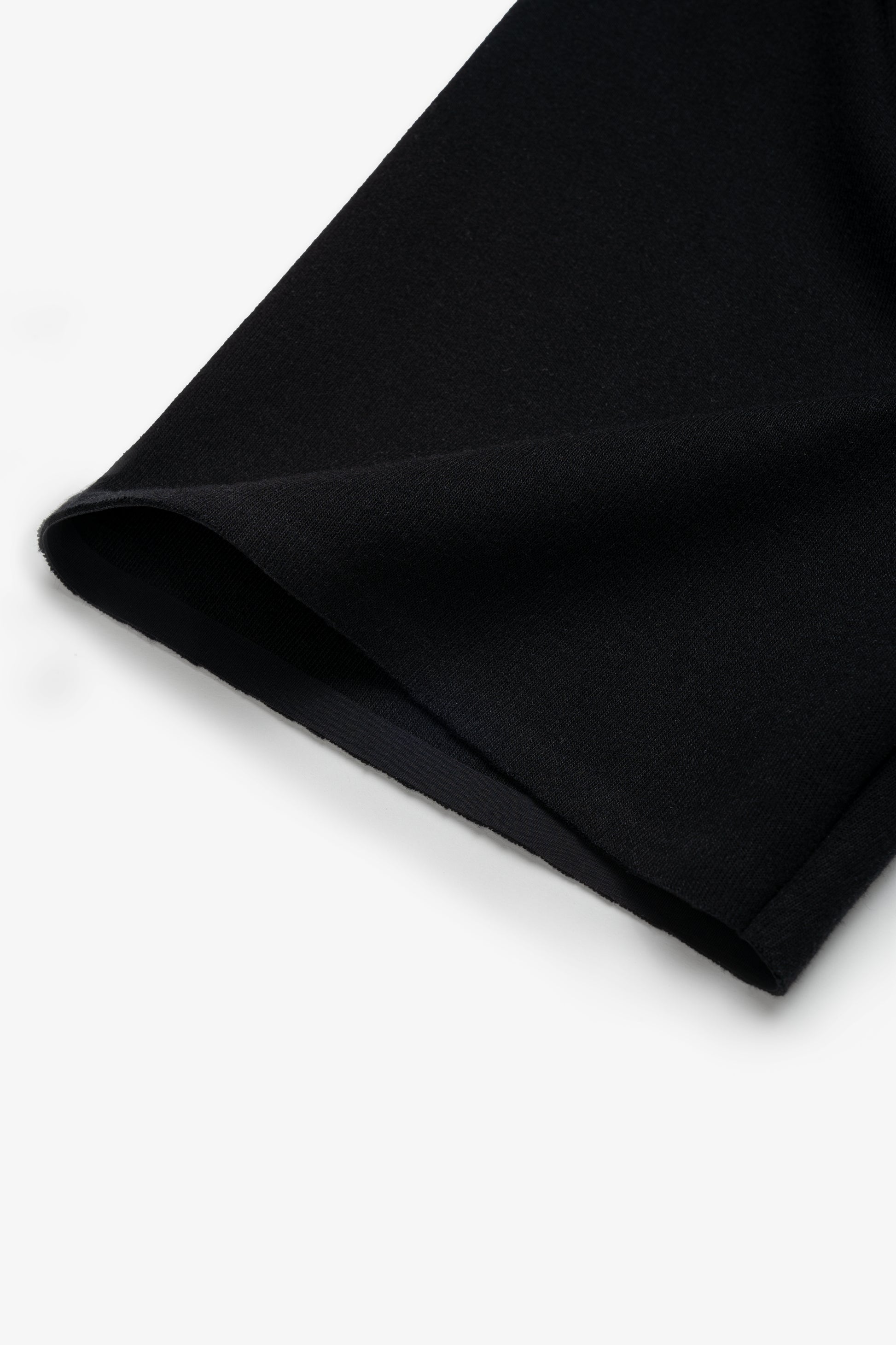 Close up of black boxy t-shirt sleeve detail 